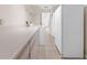 Spacious laundry area featuring counter space, washer, dryer and cabinet space with tile floors, window, and appliances at 17125 Canary Ln, Port Charlotte, FL 33948