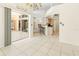 Open concept living space leading to an outdoor patio with barstool seating and tile flooring at 17125 Canary Ln, Port Charlotte, FL 33948