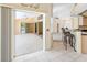 View of an open living space featuring outdoor patio access, tile floors, and kitchen views at 17125 Canary Ln, Port Charlotte, FL 33948