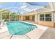 A refreshing screened in pool, ideal for relaxation and outdoor enjoyment at 17125 Canary Ln, Port Charlotte, FL 33948