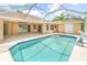 A refreshing screened in pool, ideal for relaxation and outdoor enjoyment at 17125 Canary Ln, Port Charlotte, FL 33948