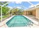 A refreshing screened in pool, ideal for relaxation and outdoor enjoyment at 17125 Canary Ln, Port Charlotte, FL 33948