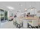 Open concept kitchen featuring granite countertops, white cabinets, and stainless steel appliances at 1722 Amnesty Dr, North Port, FL 34288