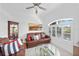 Cozy living room with plantation shutters, crown molding, and comfortable seating at 1722 Amnesty Dr, North Port, FL 34288
