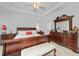 Elegant main bedroom with a large bed, dresser, and stylish decor accents at 1722 Amnesty Dr, North Port, FL 34288