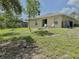 Expansive backyard with a firepit offering great outdoor living and entertainment at 17344 York Ave, Port Charlotte, FL 33948