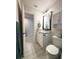 Clean bathroom with white cabinetry, granite countertops, and tile flooring at 17344 York Ave, Port Charlotte, FL 33948