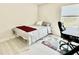 Comfortable bedroom with neutral walls and floor, natural lighting and simple furnishings at 17344 York Ave, Port Charlotte, FL 33948
