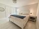 Bright bedroom featuring a large window and a ceiling fan for added comfort at 17344 York Ave, Port Charlotte, FL 33948