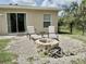 Cozy fire pit area in the backyard, perfect for outdoor gatherings and relaxation at 17344 York Ave, Port Charlotte, FL 33948