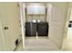 Convenient laundry room with a full-size washer and dryer, maximizing efficiency at 17344 York Ave, Port Charlotte, FL 33948