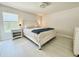 Spacious bedroom featuring a large bed, side table, and natural light at 17344 York Ave, Port Charlotte, FL 33948