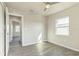 A well-lit bedroom showing view to the hallway and open door at 175 Rodgers Ne Ave, Port Charlotte, FL 33952