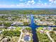Extensive aerial view of a residential waterfront community, showcasing canals and scenic surroundings at 18610 Fort Smith Cir, Port Charlotte, FL 33948