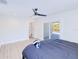 Bright main bedroom has en suite bathroom, sliding door access to pool, and fan at 18610 Fort Smith Cir, Port Charlotte, FL 33948