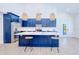 Modern kitchen boasts a center island, stylish pendant lighting, and sleek appliances, great for entertaining guests at 18610 Fort Smith Cir, Port Charlotte, FL 33948