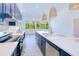 Well-appointed kitchen featuring modern appliances, a center island, and ample counter space for preparing meals at 18610 Fort Smith Cir, Port Charlotte, FL 33948