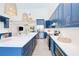 The kitchen's quartz countertops, stainless appliances, and kitchen island add to its appeal for cooking and entertaining at 18610 Fort Smith Cir, Port Charlotte, FL 33948