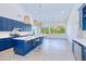 Bright kitchen features a large island, modern appliances, and plenty of natural light from the expansive windows at 18610 Fort Smith Cir, Port Charlotte, FL 33948