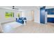 Open concept living space features hard surface floors and seamless flow into the modern kitchen area at 18610 Fort Smith Cir, Port Charlotte, FL 33948