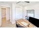 Office area with desk, modern furniture, and a view to the charming bathroom nearby at 18610 Fort Smith Cir, Port Charlotte, FL 33948