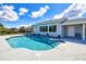 Sparkling pool with stamped concrete patio, well-maintained landscaping and home exterior at 18610 Fort Smith Cir, Port Charlotte, FL 33948