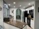 Updated kitchen featuring granite counters, stainless steel appliances, and ample cabinet space at 21287 Birwood Ave, Port Charlotte, FL 33954