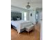 Beautiful bedroom featuring a plush bed, stylish lighting, and elegant decor at 21287 Birwood Ave, Port Charlotte, FL 33954