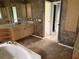 Bathroom with tub, decorative paint, and double sinks at 2143 Santonian Ter, North Port, FL 34286