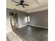 Spacious bedroom with dark wood-look laminate flooring and neutral walls at 2143 Santonian Ter, North Port, FL 34286