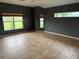 Empty bedroom with large windows, tile floors, and gray paint at 2143 Santonian Ter, North Port, FL 34286
