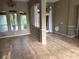 Open dining area with tile flooring, chandelier, and decorative trim at 2143 Santonian Ter, North Port, FL 34286