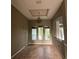 Dining room with tile flooring, decorative chandelier, and windows offering natural light at 2143 Santonian Ter, North Port, FL 34286