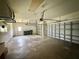 Spacious garage with automatic doors, ample lighting, and lots of room for storage and parking at 2143 Santonian Ter, North Port, FL 34286