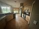 Bright eat-in kitchen features tile floors, stainless appliances, and breakfast nook at 2143 Santonian Ter, North Port, FL 34286