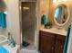 Well-lit bathroom with marble countertops, tile floor, separate shower, and bath at 21460 Sheldon Ave, Port Charlotte, FL 33952