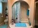 Well-lit bathroom with marble countertops, tile floor, and combined shower and tub at 21460 Sheldon Ave, Port Charlotte, FL 33952