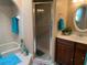 Well-lit bathroom with marble countertops, tile floor, separate shower, and bath at 21460 Sheldon Ave, Port Charlotte, FL 33952