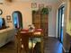 Cozy dining area featuring a wooden table and chairs, with a built-in bookshelf at 21460 Sheldon Ave, Port Charlotte, FL 33952