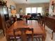 Inviting dining room featuring a spacious wooden table and traditional furnishings at 21460 Sheldon Ave, Port Charlotte, FL 33952