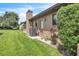 Exterior of home featuring well-maintained yard, and AC unit at 21460 Sheldon Ave, Port Charlotte, FL 33952