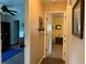 Hallway with office space to the left and carpeted bedroom to the right at 21460 Sheldon Ave, Port Charlotte, FL 33952