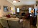 Inviting living area with stone fireplace, comfortable seating, and warm lighting at 21460 Sheldon Ave, Port Charlotte, FL 33952