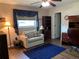 Comfortable office space with a sofa, wood-like floors, and natural light at 21460 Sheldon Ave, Port Charlotte, FL 33952