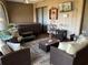 Cozy enclosed sunroom with a hot tub, comfortable seating and paneled walls at 21460 Sheldon Ave, Port Charlotte, FL 33952