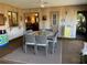 Enclosed lanai featuring a dining table with six wicker chairs and wood paneled walls at 21460 Sheldon Ave, Port Charlotte, FL 33952