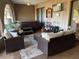 Inviting enclosed sunroom with a hot tub and comfortable wicker sofas at 21460 Sheldon Ave, Port Charlotte, FL 33952