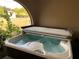 Covered hot tub on a covered patio with access to outdoor views at 21460 Sheldon Ave, Port Charlotte, FL 33952