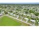 Expansive aerial view of the neighborhood, displaying the community layout and green spaces at 22219 Catherine Ave, Port Charlotte, FL 33952