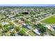 Drone shot of property highlighting its position in a tree-lined neighborhood at 22219 Catherine Ave, Port Charlotte, FL 33952